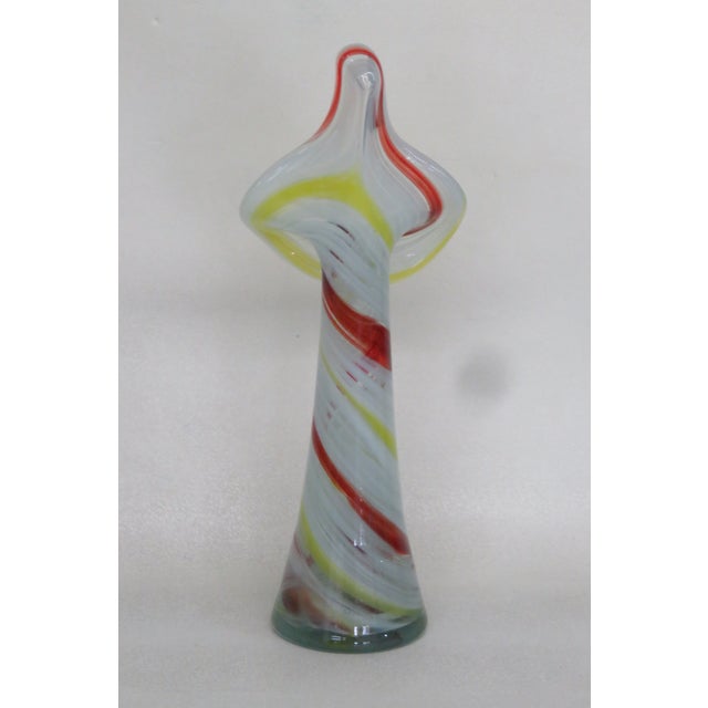 This brilliant Vase is made of glass. We believe it was made by Murano due to its style, however it is not labeled. It has...