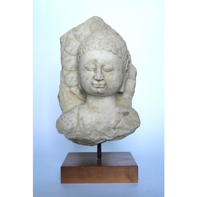 A remarkable ancient carved marble classical head of Buddha, serene and meditative, the back suggests that it may have...