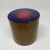 Mid-Century round brass box with enameled lid. Circa 1970s and opens for storage. Enameled in a royal blue with a red center.