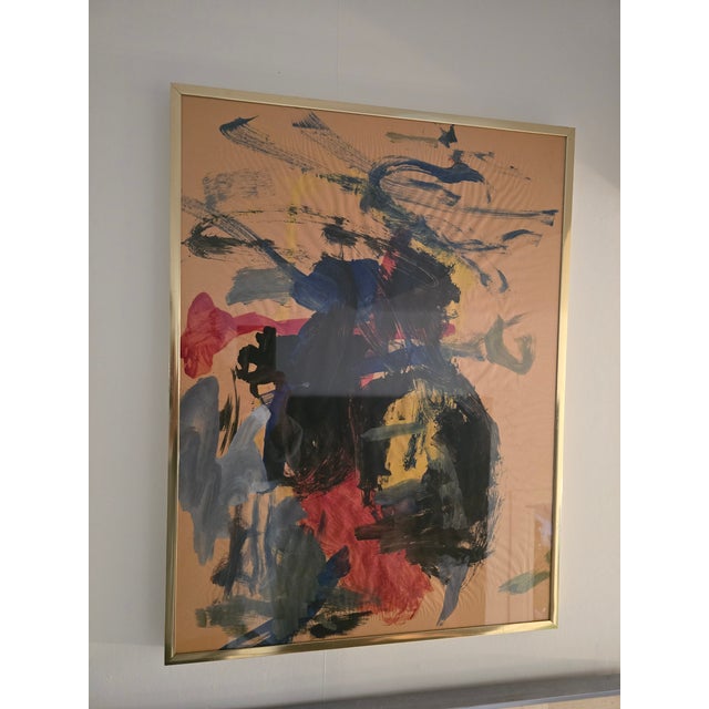 A good vintage mid century modern abstract painting on paper in it's original gold plated frame . Having glorious colors...