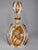 This elegant 19th-century Bohemian crystal decanter combines clear faceted crystal with warm amber glass and delicate...