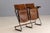 This two-seat folding bench dates to the 1930s and reflects the functionalist and Bauhaus design principles of the...