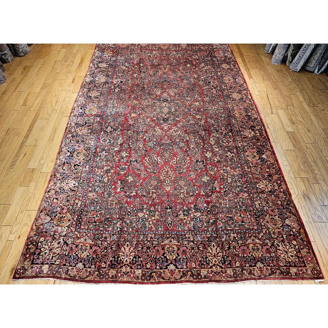 "This exquisite vintage oversized Persian Sarouk rug from the second quarter of the 20th century is a grand statement...