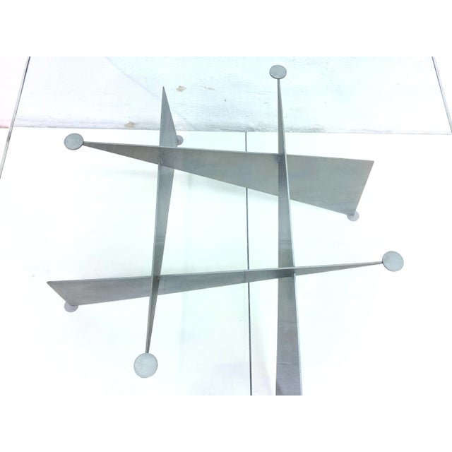 1 coffee table from the 1980s and 1990s. Metal frame, glass top. Overall good used condition. 1 chip in the glass top (see...