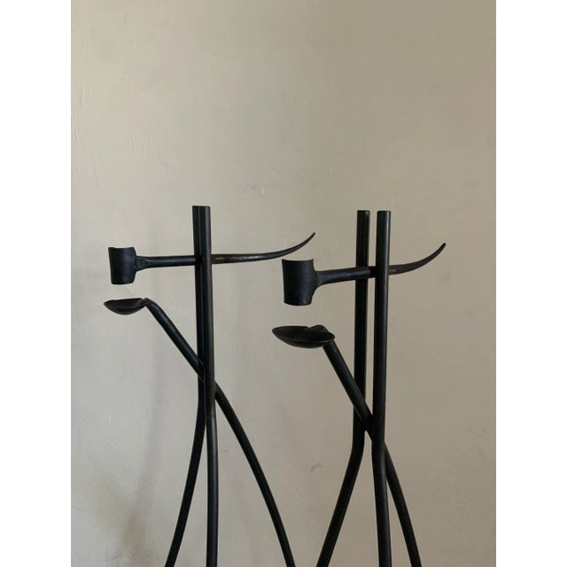 Beautiful pair of hand Forged iron candlesticks. European in nature, likely French. Uncertain of age but appearance...