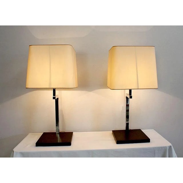 Large Height Adjustable Chrome Plated Metal Lamps from the 1960's/1970's. These lamps have a square base in black metal...