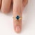 Add a refreshing splash of vibrant blue to your jewelry rotation with this serene curved solitaire ring. Designed with a...