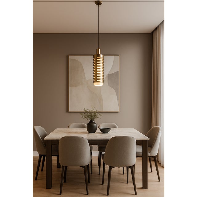 Pollux Singola is a metal pendant light made in Italy, characterized by a compact, vertical shape. The perforated...