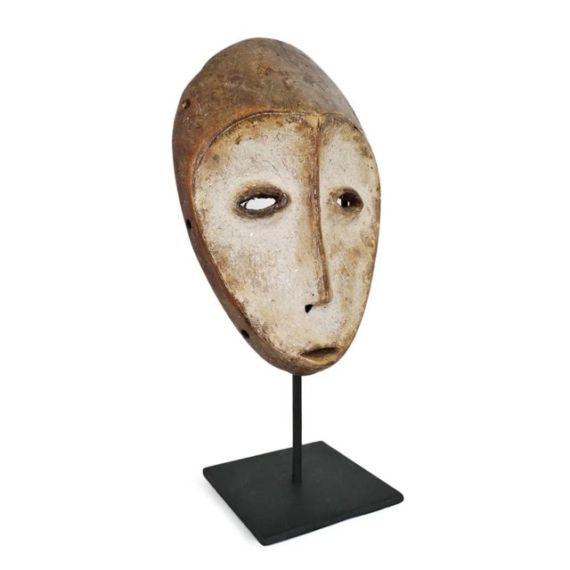 Original Lega passport mask on stand. Traditionally during initiation into the Bwami societies and for tribal...