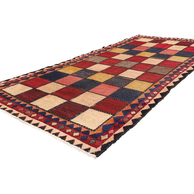 78891 Vintage Persian Checkerboard Rug, 04'07 x 09'02. This hand-knotted wool vintage Persian Lori rug is a striking...