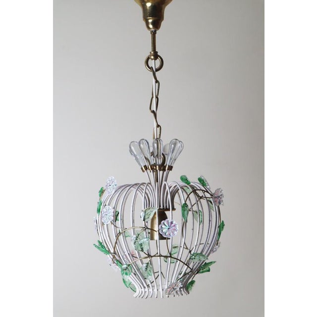 Hanging lamp with a birdcage design that's absolutely charming! it is decorated with lovely, colorful glass blossoms and...
