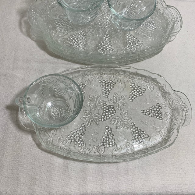 Offered here is a vintage Anchor Hocking clear pressed glass "Serva-Snack" set featuring an embossed grape cluster and...