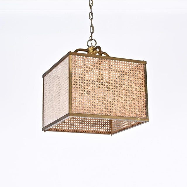 Marvellous chandelier made is solid brass, glass and vienna straw wicker. This rare light was realized in italy in the...