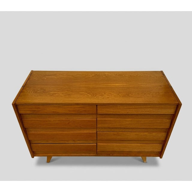 Functional mid-century chest of drawers with clean lines and practical storage, designed for everyday use. Designed by...