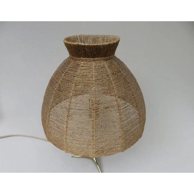 Table lamp, crow's foot, 50s, Austria, brass, wood, lampshade covered with cord, in the style of T.J. Kalmar. The lamp has...