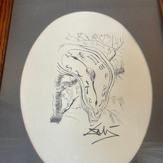 1960’s original Melting Clock lithograph by Salvador Dali. Signed in pencil and framed. Image itself measures about 5.5x8...