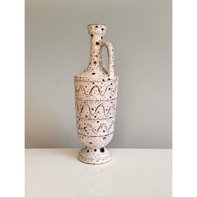 A striking ceramic vase from the GDR of the 1970s, designed in a style typical of the period, combining graphic decoration...