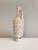 A striking ceramic vase from the GDR of the 1970s, designed in a style typical of the period, combining graphic decoration...
