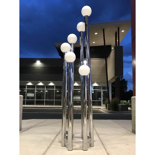 Sculpturally designed chrome torchiere floor lamp from Lightolier. This sleekly constructed standing lamp consists of six...