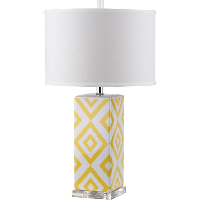Fresh and graphic, the Diamonds table lamp by brings a welcome pop of color to transitional rooms. Crafted of yellow and...