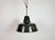 Industrial black enamel pendant light made in Germany during the 1950s. White enamel inside the shade. Iron top. The...