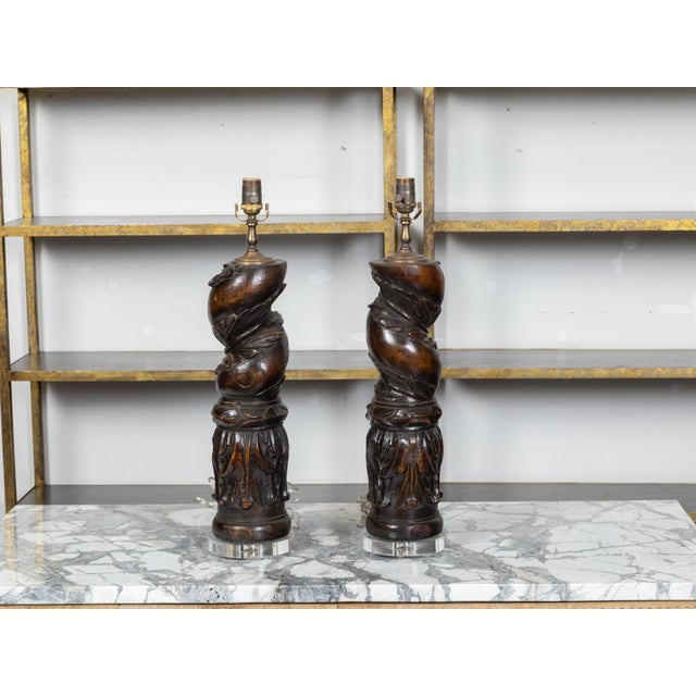 A pair of Italian carved walnut fragments from the 19th century depicting Solomonic columns wrapped with foliage and...