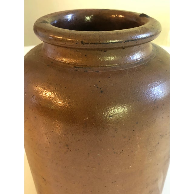 Rustic French confit pot. 9.25" tall and 6" wide. Some light surface ware consistent with age.