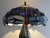 Henri Javaux Tiffany style lamp, sandstone foot The whole in good general condition Height 62 cm Diameter 42 cm This piece...
