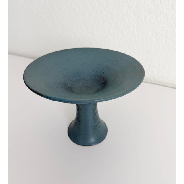 1970s hand-thrown studio pottery pedestal bowl featuring a splayed base, zig-zag detail embossed on the neck, and a French...