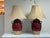 Design Plus Gallery presents a Pair of Rowe Pottery Works Table Lamps. Glazed ceramic bodies in a deep oxblood tone...