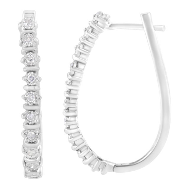 Crafted in cool sterling silver, these stunning hoop earrings feature 1/4ct TDW of diamonds. Each hoop features glittering...