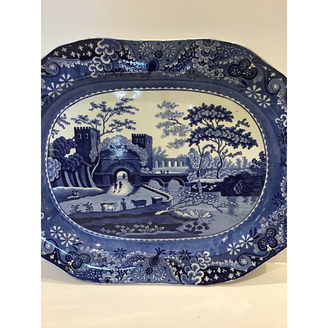 A beautiful 19th century English blue and white transferware. It depicts a peaceful riverside village. It would be a...