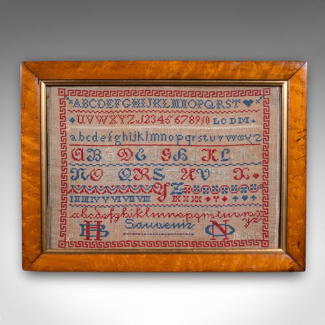 This is an antique needlework sampler. An English, framed embroidered panel, dating to the William IV period, circa 1835....