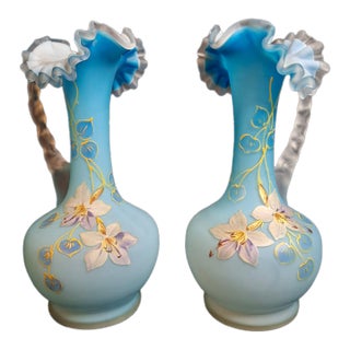 Antique Pair Victorian Blue Satin Cased Glass Pitcher Ewers Hand Painted Orchids Frosted Coral Branch Handles Ruffled Rim - a Pair For Sale