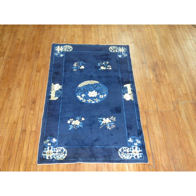 Stunning deep blue and ivory accent full pile condition antique Chinese Peking rug, circa 1920. Measures: 4' x 6'9".