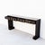 A substantial black lacquer console table, designed in a restrained Ming-style and produced in China c. 1930s. Measuring...