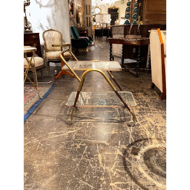 The Italian MCM Gio Ponti Style Bar Cart is a sleek and stylish serving cart inspired by the iconic designs of Gio Ponti....