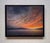 Afterburn captures a serene twilight landscape where vibrant hues of orange and pink blend seamlessly into cooler tones of...