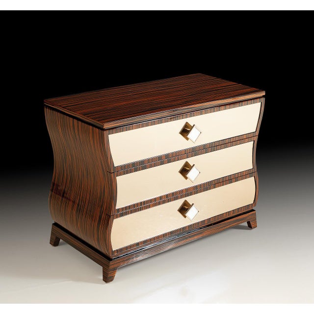 Handcrafted in Italy, this contemporary nightstand features rich Makassar ebony veneers with dramatic grain patterns that...
