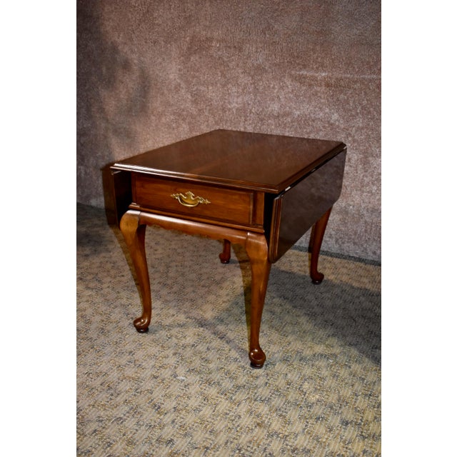 Vintage Queen Anne Ethan Allen Solid Cherry Drop Leaf Side Table Chairish Also cabinets are on casters.