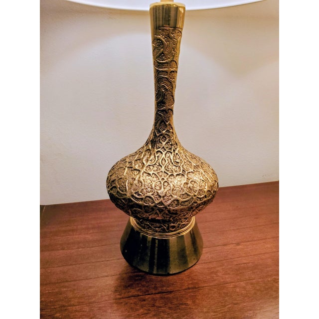 Stunning pair of lacquered brass mid-century lamps with ornate scroll detail throughout. Estimated 50's-70's based on...