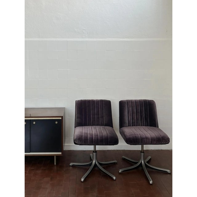 Pair of armchairs reupholstered with high quality cotton velvet with aubergine, base deliberately left worn with signs of...