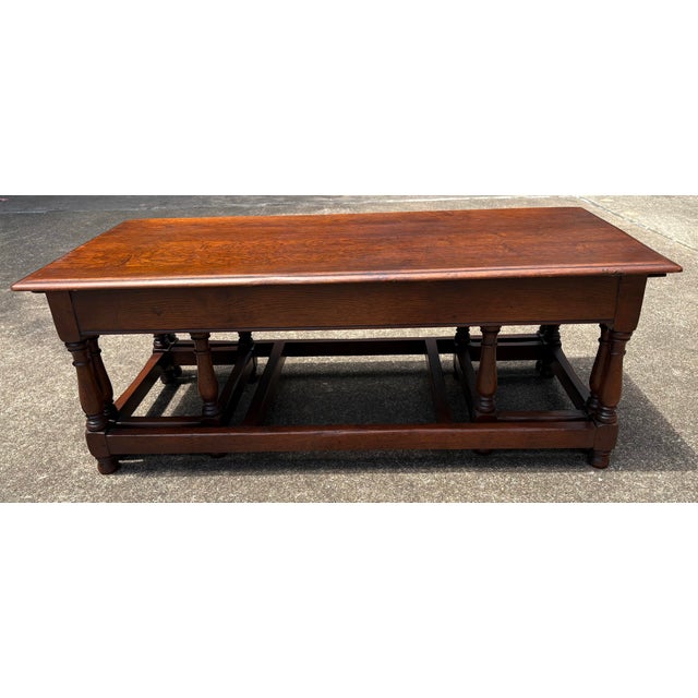 Love this set of coffee table plus two matching, nesting pull out end tables! End tables measure 18” x 14” x 16”.