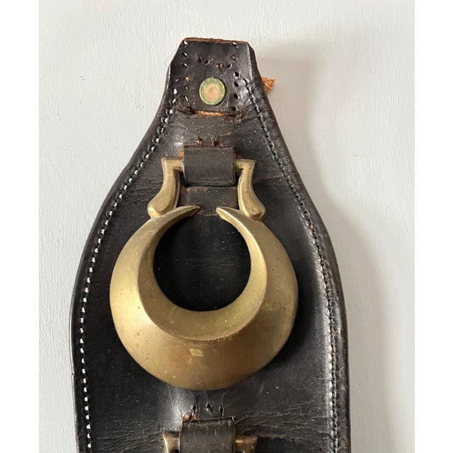 This leather strap was hung from horse saddles/harnesses during parades or other special events. Some of the medallions...
