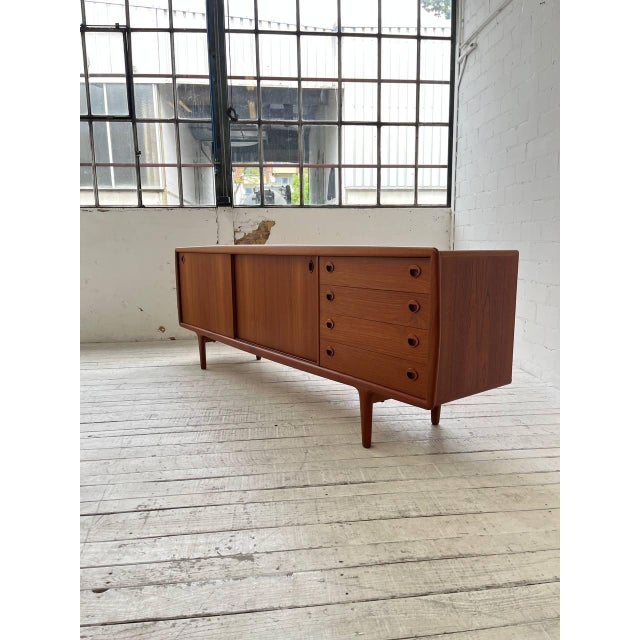 This beautiful design by HP Hansen is made entirely of teak and offers plenty of storage space, two sliding doors, four...