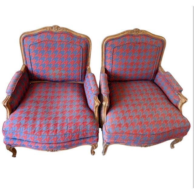 Elevate your living space with this striking pair of vintage French Provincial bergère armchairs. Crafted with timeless...