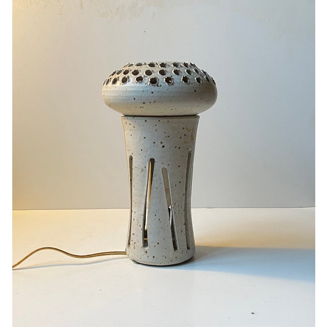 A one of a kind - piece unique table lamp studio-made af ting keramik in denmark during the 1970s. It was made and...