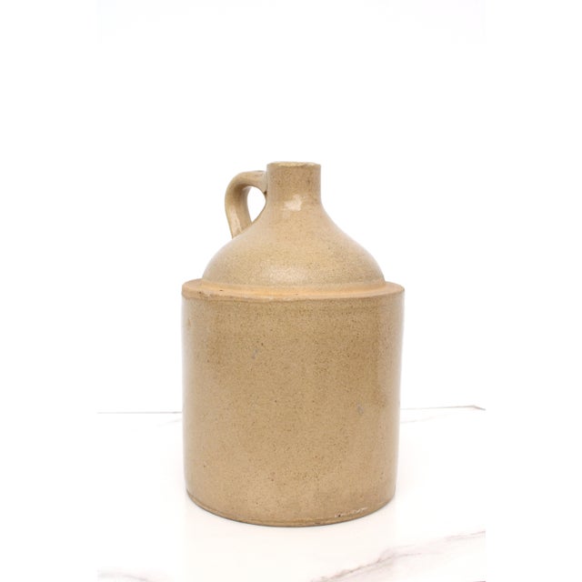 Antique French glazed stoneware jug with handle. This jug is early 20th Century and stands proud in it's beautiful golden...