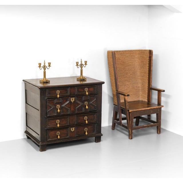 A small proportion Charles II joined oak chest of drawers with applied geometric mouldings to the façade and a deep, rich...