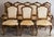 This is a set of twelve Louis XV-style dining chairs by Karges: two armchairs and ten side chairs. Each chair has a hand-...